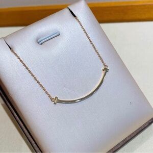 Tiffany & Co. Elegant Gold Arc Necklace